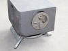 secure lock on corner casting and twist lock